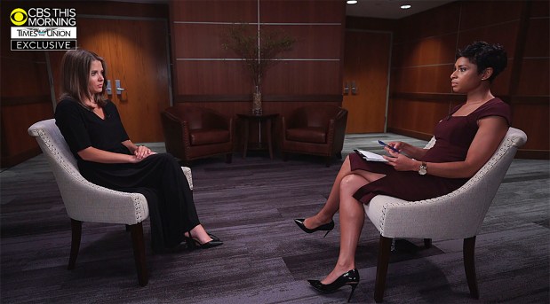 FILE - In this image provided by CBS This Morning/Times Union Brittany Commisso, left, discusses her sexual harassment allegations against Gov. Andrew Cuomo, during an interview with CBS correspondent Jericka Duncan on CBS This Morning, Sunday, Aug. 8, 2021, in New York. Cuomo will be required to appear virtually for a court session Friday, Jan. 7, 2022, as a judge considers a prosecutor's request to dismiss the case against him because it doesn't meet the burden of proof. (CBS This Morning and Times Union via AP, File)