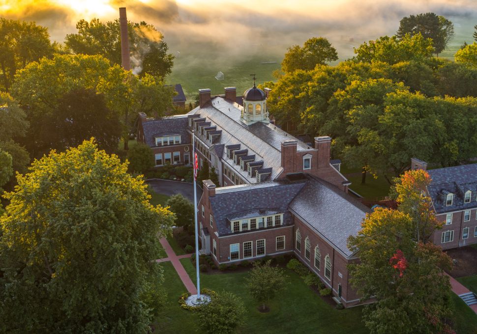 Aerial view of picturesque building located among green trees