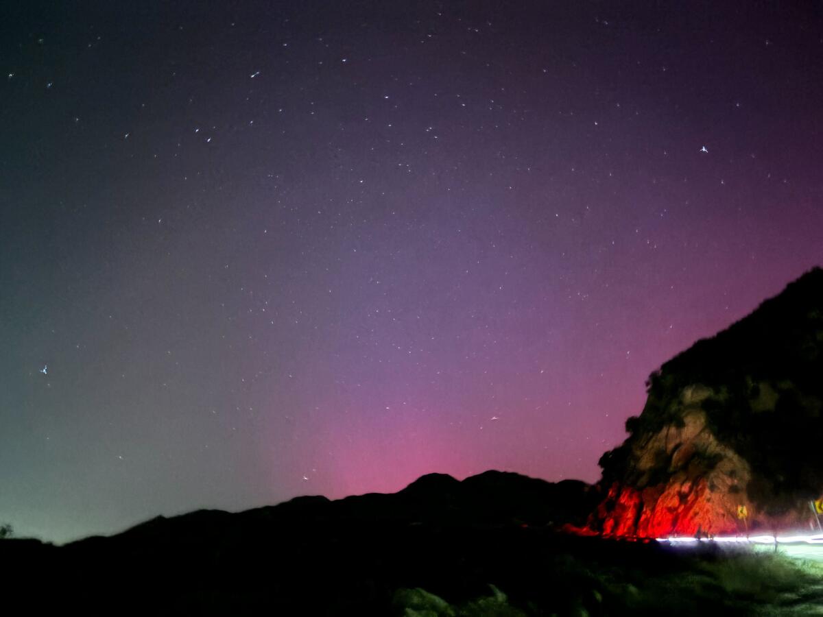 Purple light from the aurora borealis over Highway 2 in L.A. County.