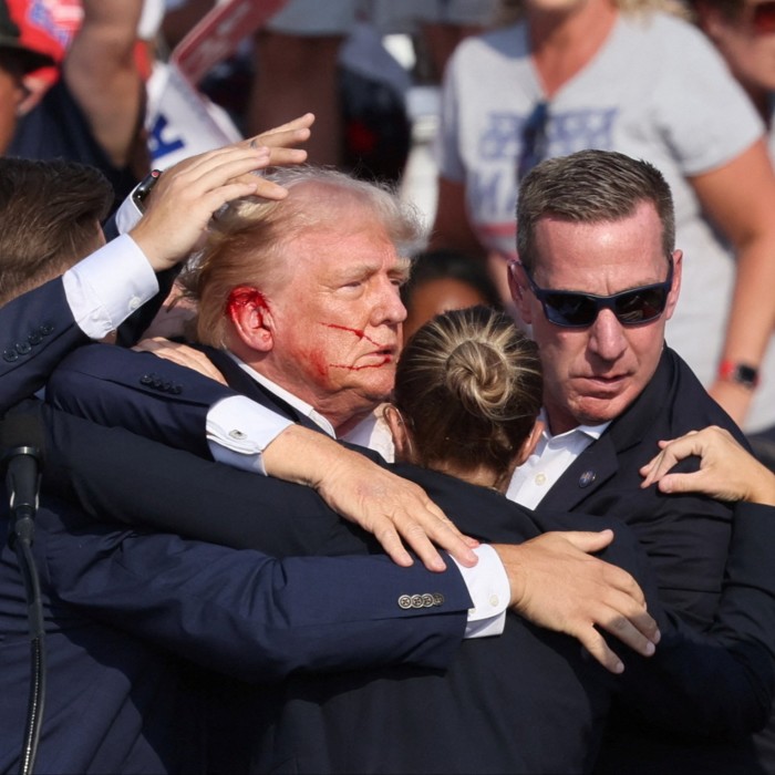 Donald Trump is rushed offstage by Secret Service 