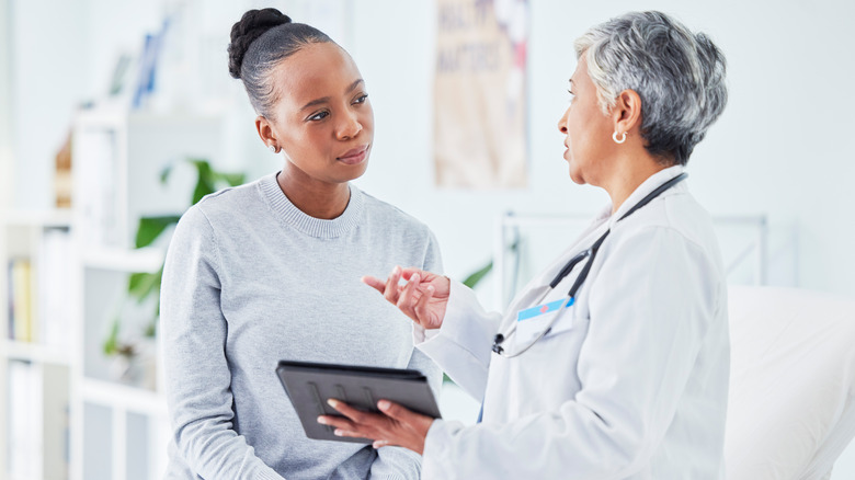 woman visiting with her doctor