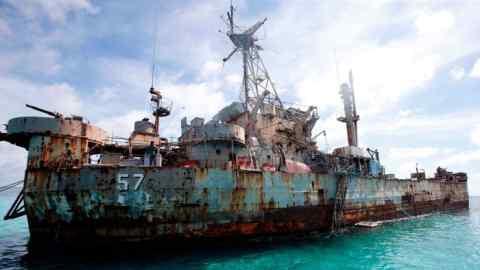 Members of a military detachment move around aboard the BRP Sierra Madre, run aground on the disputed Second Thomas Shoal