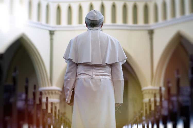 Pope holding a Bible