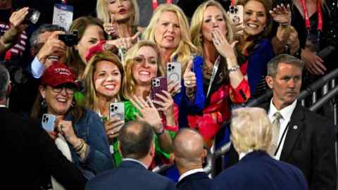 Donald Trump greets supporters as he departs following the second day of the Republican National Convention at the Fiserv Forum on July 16, 2024 in Milwaukee, Wisconsin